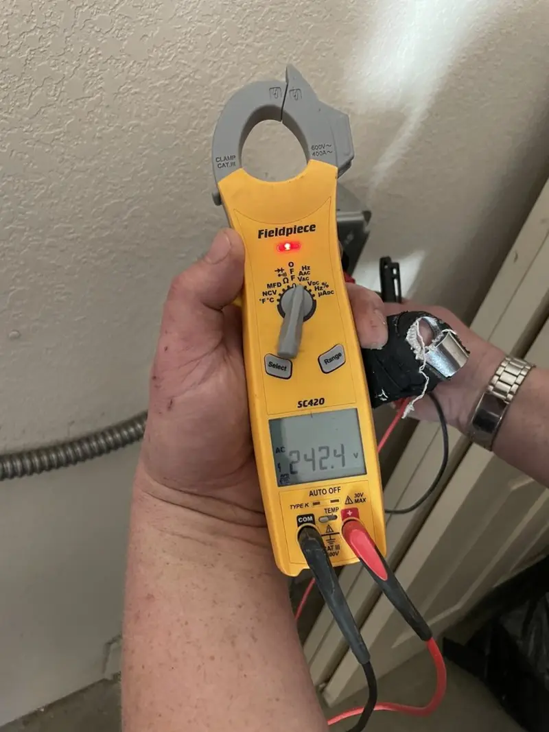 Voltage testing with clamp meter during Circuit Breaker Repair in Aurora